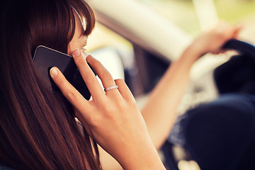 Image showing woman using phone while driving the car