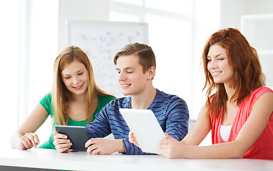 Image showing smiling students with tablet pc at school