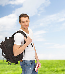 Image showing travelling student with backpack and book