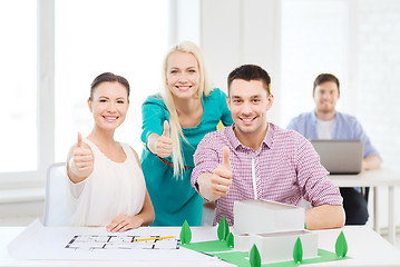 Image showing smiling architects working in office