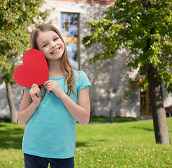 Image showing smiling little girl with red heart