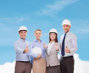 Image showing happy business team in office showing thumbs up