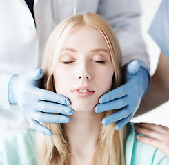 Image showing plastic surgeon or doctor with patient