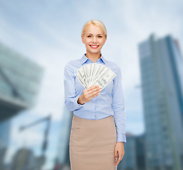 Image showing young businesswoman with dollar cash money