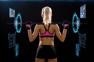 Image showing sporty woman exercising with barbell