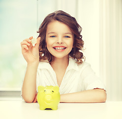 Image showing girl with piggy bank