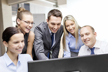 Image showing business team with monitor having discussion