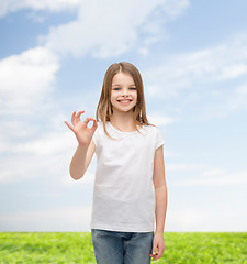 Image showing little girl in white t-shirt showing ok gesture