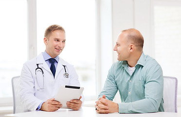 Image showing doctor with tablet pc and patient in hospital