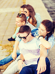 Image showing group of smiling teenagers hanging out