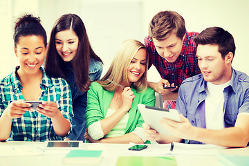 Image showing students looking at smartphones and tablet pc
