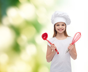 Image showing smiling girl in cook hat with ladle and whisk