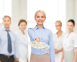 Image showing young businesswoman with dollar cash money