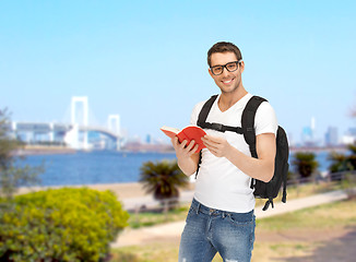 Image showing travelling student with backpack and book