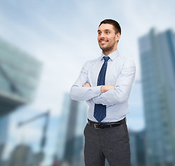 Image showing handsome businessman with crossed arms