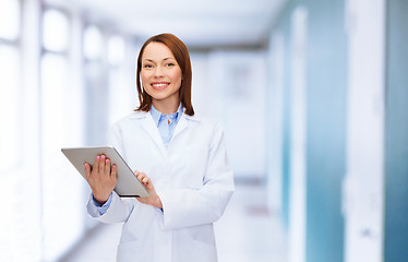 Image showing smiling female doctor and tablet pc computer