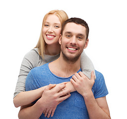 Image showing smiling couple hugging