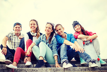 Image showing group of smiling teenagers hanging out