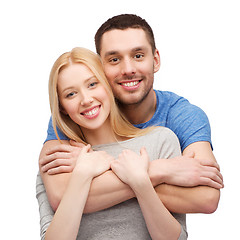 Image showing smiling couple hugging