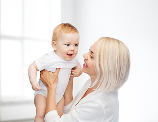 Image showing happy mother with smiling baby