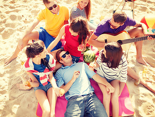 Image showing group of friends having fun on the beach