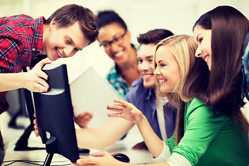 Image showing students looking at computer monitor at school