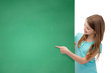 Image showing happy little girl with blank blackboard