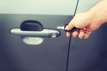 Image showing man with car key outside