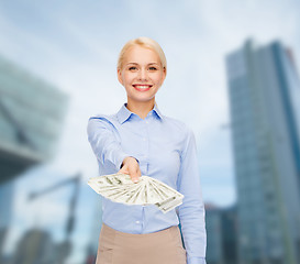 Image showing young businesswoman with dollar cash money