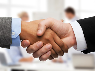 Image showing businessman and businesswoman shaking hands