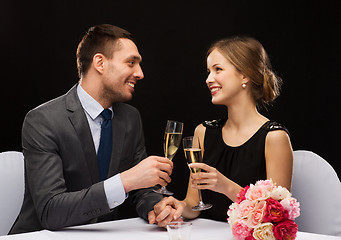 Image showing couple with glasses of champagne at restaurant