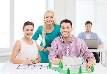Image showing smiling architects working in office