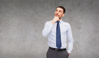 Image showing handsome businessman looking up