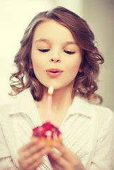 Image showing girl with cupcake