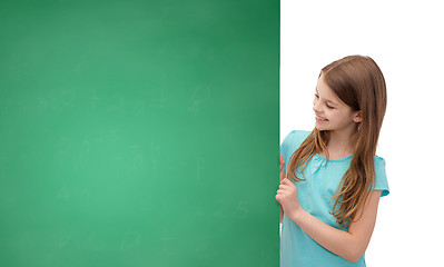 Image showing happy little girl with blank blackboard