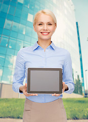 Image showing businesswoman with blank black tablet pc screen