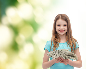 Image showing smiling little girl with dollar cash money