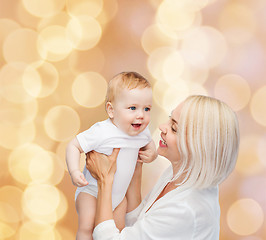 Image showing happy mother with smiling baby