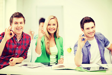 Image showing students with tablet pcs showing ok sign