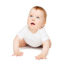 Image showing crawling curious baby looking up