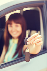 Image showing happy woman holding car key