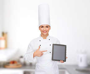 Image showing smiling female chef with tablet pc blank screen