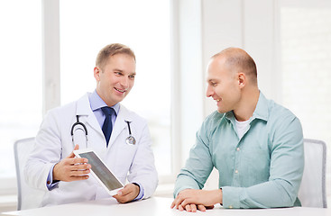 Image showing doctor with tablet pc and patient in hospital