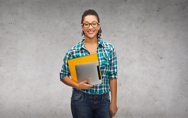 Image showing student in eyeglasses with folders and tablet pc