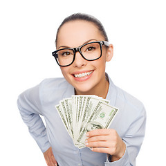 Image showing smiling businesswoman with dollar cash money