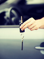 Image showing man with car key outside