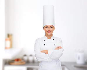 Image showing smiling female chef with crossed arms