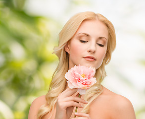 Image showing lovely woman with peony flower