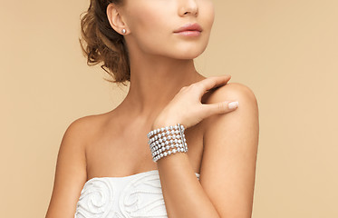 Image showing woman with pearl earrings and bracelet