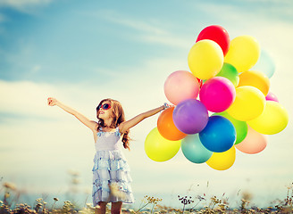 Image showing happy girl with colorful balloons